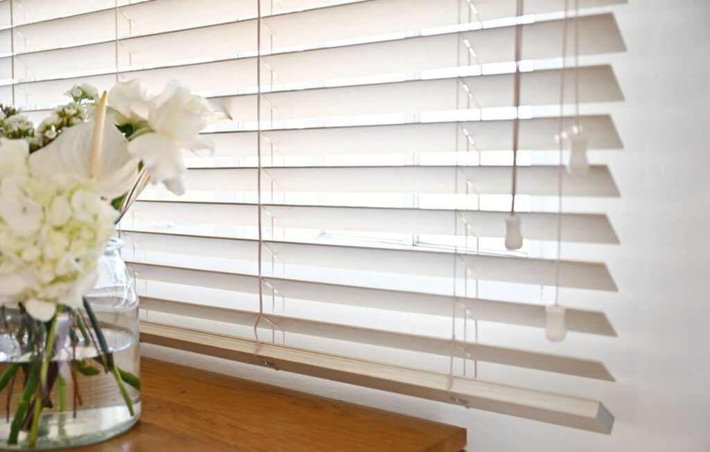 close up of light beige wooden venetian blinds in Kent